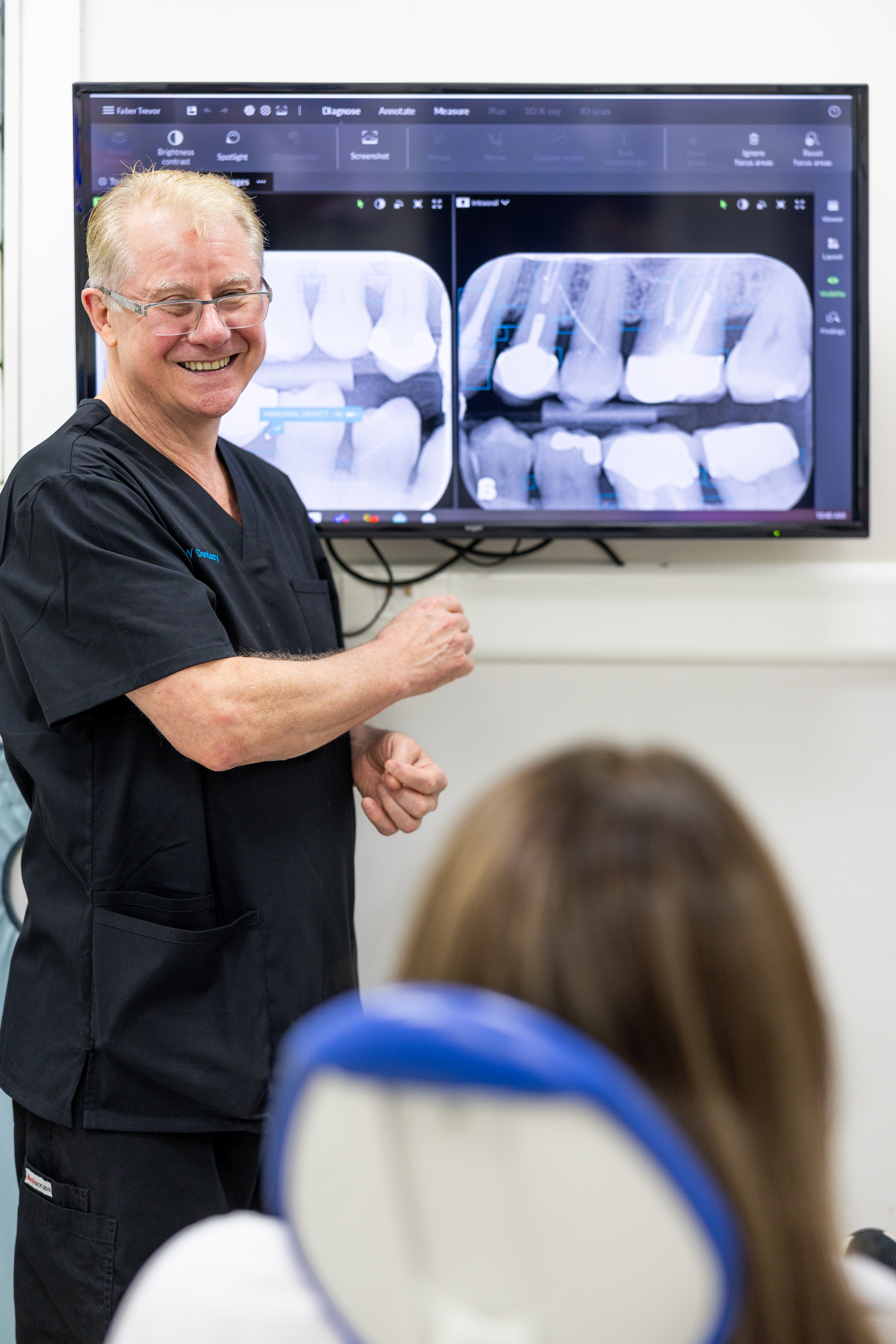 Dr Walker explaining treatment to patient